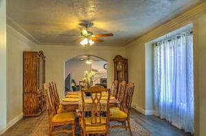 a dining room with a table and a ceiling fan at Central Escalante Home about 5 Mi to Grand Staircase! in Escalante
