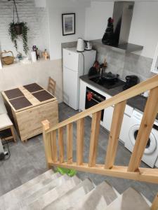 A kitchen or kitchenette at Cozy Apartment Malasaña FREE Parking