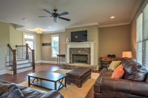 a living room with a couch and a fireplace at Spacious Family-Friendly Retreat with Winter Rates! in Greensboro