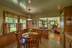 a kitchen and dining room with a table and chairs at Ephraim Vacation Rental - 3 Mi to Fish Creek Beach in Ephraim