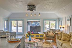 a living room with a couch and a table at Victorian Carpinteria Apartment Less Than 1 Mi to Beach! in Carpinteria