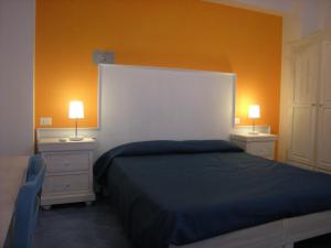 Un pat sau paturi într-o cameră la Residence Timeo