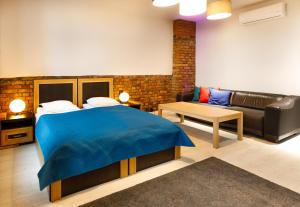 Postel nebo postele na pokoji v ubytování Apartamenty Vilda