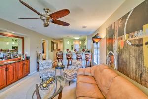 a living room with a couch and a ceiling fan at Myrtle Beach Oasis on River Oaks Golf Course! in Myrtle Beach