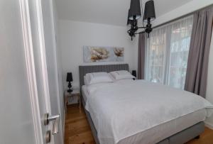 Postel nebo postele na pokoji v ubytování Apartmán Alexander Tatranská Lomnica