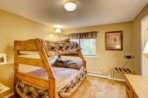 a bedroom with two bunk beds and a window at Private Hot Tub and Deck Breckenridge Abode! in Breckenridge