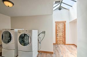 a washer and dryer in a room with a window at Updated Main St Apt Near Fishlake and Capitol Reef! in Salina