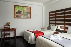 מיטה או מיטות בחדר ב-Hotel Rulman