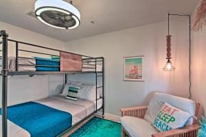 a bedroom with a bunk bed and a couch at Emerald Hideaway Renovated Condo in Navarre Beach in Navarre +20 photos