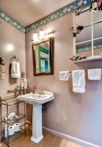 A bathroom at Astoria Painted Lady Historic Apt with River View!