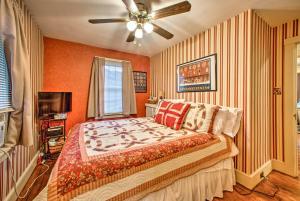 a bedroom with a bed and a ceiling fan at Whimsical Lancaster House with Porch, Near Amish Farm in Lancaster