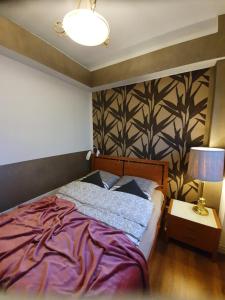 Ένα ή περισσότερα κρεβάτια σε δωμάτιο στο Apartament City Center - 24 h contactless self check-in, no smoking, free bottled water, coffee and tea +9 φωτογραφίες