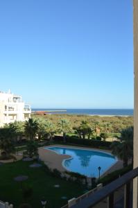 a view from the balcony of a resort with a swimming pool at Apartamentos Solmares in Isla Canela