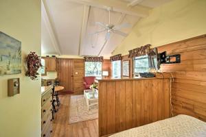 a bedroom with wooden walls and a ceiling at Cozy Cottage Duplex Walk to Peninsula State Park! in Ephraim
