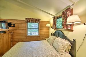a bedroom with a bed and a window at Cozy Cottage Duplex Walk to Peninsula State Park! in Ephraim