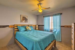 a bedroom with a bed and a ceiling fan at Lake Havasu Getaway with Patio - Hike, Swim, and Golf! in Lake Havasu City