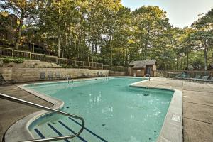 a swimming pool in a park with a playground at Wintergreen Resort Mountain Condo with Pool Access! in Lyndhurst