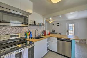 a kitchen with stainless steel appliances and a counter top at Trendy Apt on Route 66 - Near Standin on a Corner in Winslow
