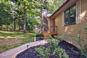 a home with a pathway leading to the front door at Arden Vacation Rental with Private Hot Tub and Grill! in Arden