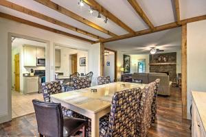 a dining room with a table and chairs at Arden Vacation Rental with Private Hot Tub and Grill! in Arden