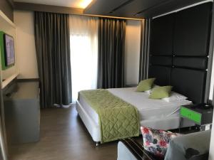 Postel nebo postele na pokoji v ubytování Oyster Boutique Hotel
