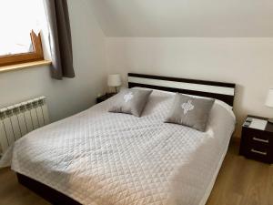 Łóżko lub łóżka w pokoju w obiekcie Apartamenty u Krysi
