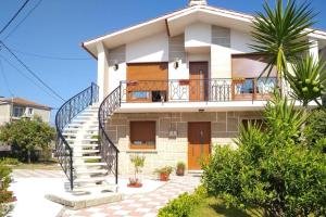 a house with a staircase in front of it at Apartamento Teresa in Pontevedra