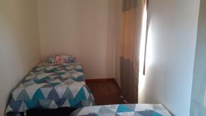 Ein Bett oder Betten in einem Zimmer der Unterkunft Cabañas de Campo Colbún