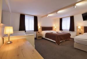 Posteľ alebo postele v izbe v ubytovaní Hotel Hvezda
