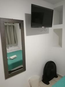 TV a/nebo společenská místnost v ubytování Kayva