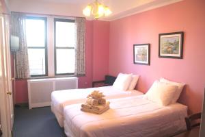 A bed or beds in a room at Leo House