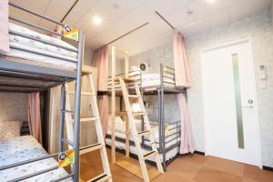 a bedroom with a bunk bed and a ladder at Akasaka-no Sato (Female Only) in Tokyo