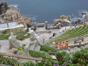 a set of stairs with the ocean in the background at Sennen Cove Cottage in Sennen Cove