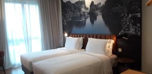 Postel nebo postele na pokoji v ubytování Travelodge Ipoh