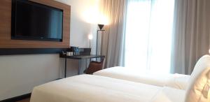 Postel nebo postele na pokoji v ubytování Travelodge Ipoh