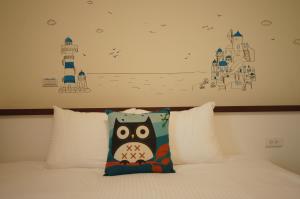Tempat tidur dalam kamar di Com Inn-花蓮後車站電梯停車場