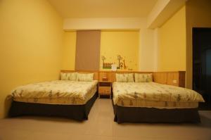 Tempat tidur dalam kamar di Com Inn-花蓮後車站電梯停車場