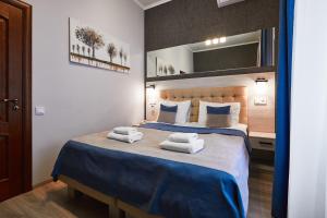 Postel nebo postele na pokoji v ubytování ANTARES Apart hotel