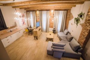 a living room with a couch and a table at Casa Verde - Brasov Homes in Braşov