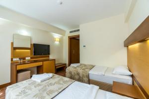 Postel nebo postele na pokoji v ubytování Afytos Bodrum City + 14 fotografií