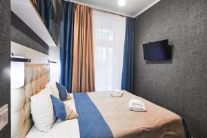Postel nebo postele na pokoji v ubytování ANTARES Apart hotel