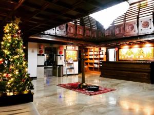 a christmas tree in the middle of a room at Sajjoys in Varkala