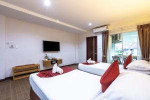 Postel nebo postele na pokoji v ubytování Tee Pak Dee Resident Phuket
