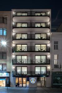 a tall building with balconies on the side of it at Qstay Good Living Apartments in Antwerp