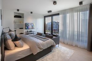 Voodi või voodid majutusasutuse Qstay Good Living Apartments toas