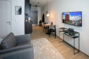Televiisor ja/või meelelahutuskeskus majutusasutuses Qstay Good Living Apartments