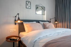 Voodi või voodid majutusasutuse Qstay Good Living Apartments toas