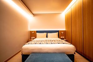 Voodi või voodid majutusasutuse Monot Suites toas