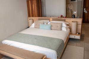 Postel nebo postele na pokoji v ubytování Le Peninsula Bay Beach Resort & Spa