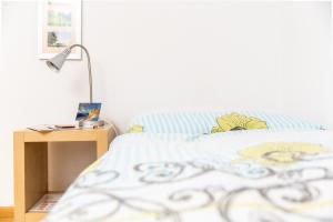Letto o letti in una camera di MyBednBreakfast in Bottmingen